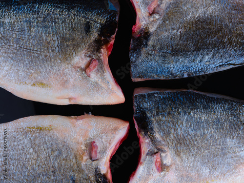 Composition Sea Bream Skin on dark background. Gilthead