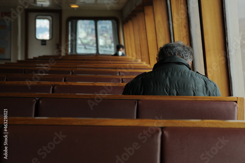 A tour on the coast of the Bosphorus in Istanbul - Turkey Boats and tourists on the Galata Bridge and Galata Tower and fishermen. Seagulls are flying, an old man and his wife are back watching the sun