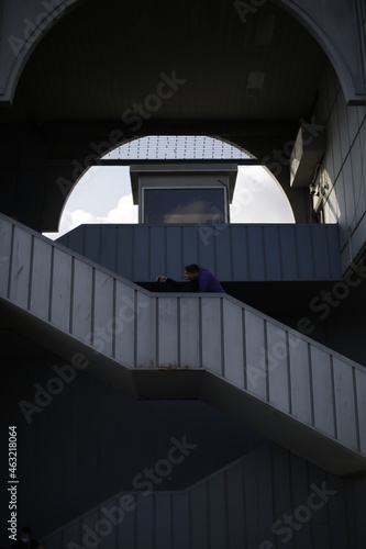 A tour on the coast of the Bosphorus in Istanbul - Turkey Boats and tourists on the Galata Bridge and Galata Tower and fishermen. Seagulls are flying, an old man and his wife are back watching the sun