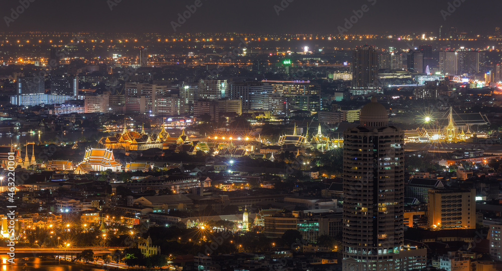 Aerial view Day to Night Time lapse of Chao Phraya River with Royal Grand Palace and Emerald Buddha Temple Landmark of Bangkok, Thailand.