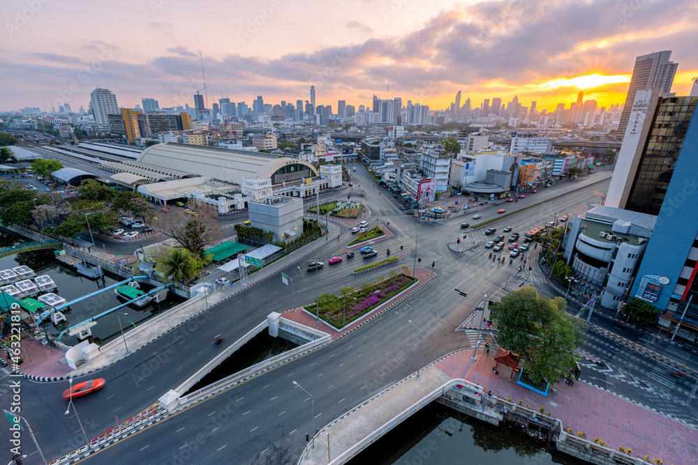 Fototapeta premium Aerial view of Hua Lamphong Railway Station busy street road. Centre intersection or junction in Bangkok Skyline. Thailand. Financial district center in smart urban city. 