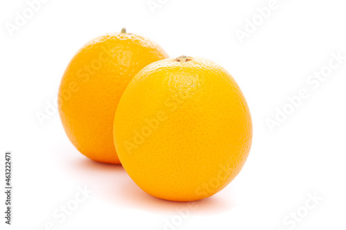Close-up of Organic Indian Citrus fruit sweet  Seedless kinnow (Kinnow mandarin)  high yield mandarin hybrid, it is yellow in color,  isolated over white background, photo