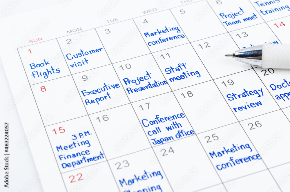 Handwriting scheduling appointments on calendar sheet. Handwriting scheduling appointments on calendar sheet.