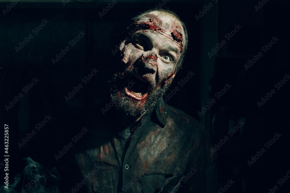 Zombie male makeup for halloween concept. Make up skin and blood face Zombie male makeup for halloween concept. Make up skin and blood face