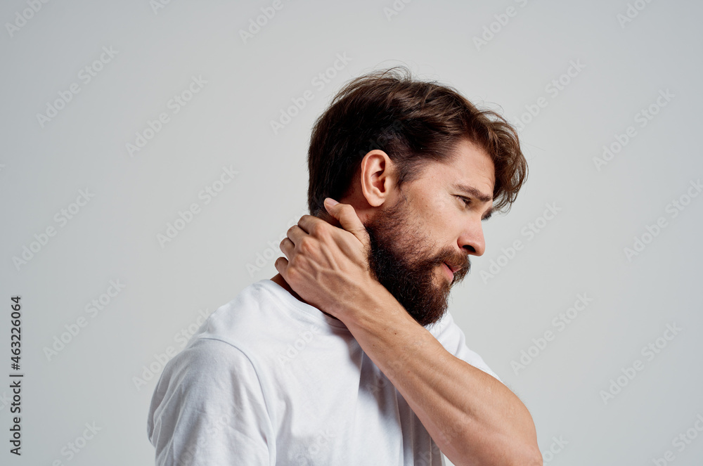 emotional man holding neck arthritis health problems light background emotional man holding neck arthritis health problems light background