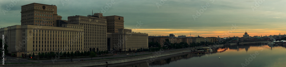 Sunrise over Moscow City and Moscow river. Early morning cityscape panorama with Ministry of Defense building on the embankment of Moskva river. Landscape of Moscow downtown