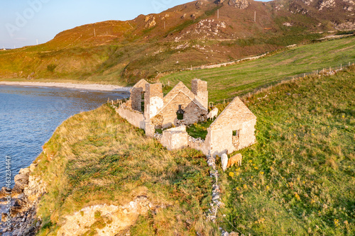 The remains of the 1790 to 1805 kelp factory Teach Dearg or the Red House at Crohy head near Maghery, Dunloe, County Donegal - Ireland photo