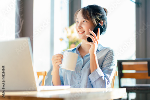 Portrait of Asian businesswoman working in a cafe