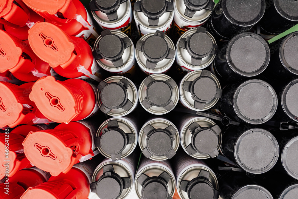 Photo of bottles with construction fluids and materials in a hardware store Photo of bottles with construction fluids and materials in a hardware store