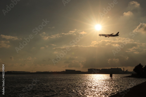 silhouette of an airplane at sunset