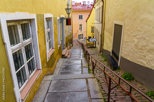 Old alley with stairs and windows on the facade of the houses. Tallinn Estonia.