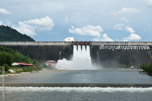 water splashing from floodgate Khun Dan Prakarn Chon huge concrete dam in Thailand