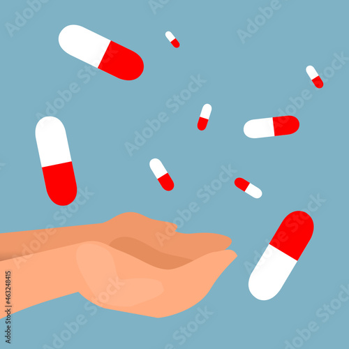 pills falling into the hands with blue background