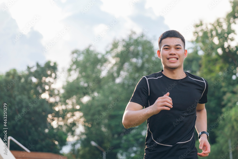 Fototapeta premium Athletic young man running in the nature.