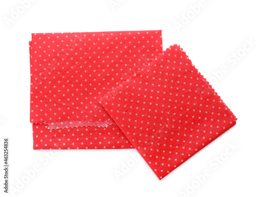 Red reusable beeswax food wraps on white background, top view