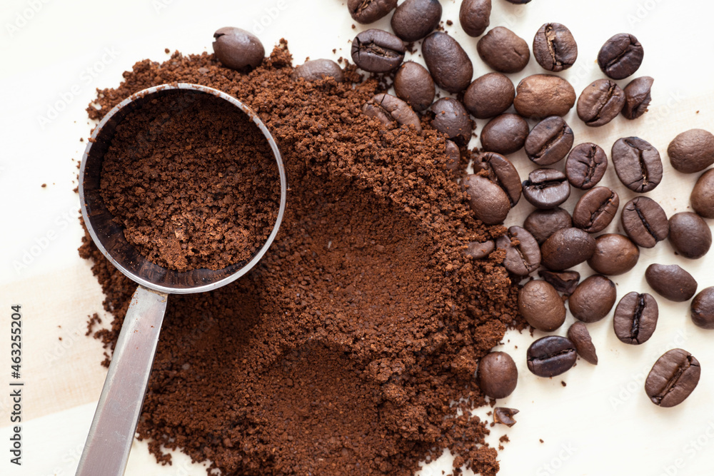 Coffee mix. Top view of ground and grains coffee on wooden table. Coffee mix. Top view of ground and grains coffee on wooden table.