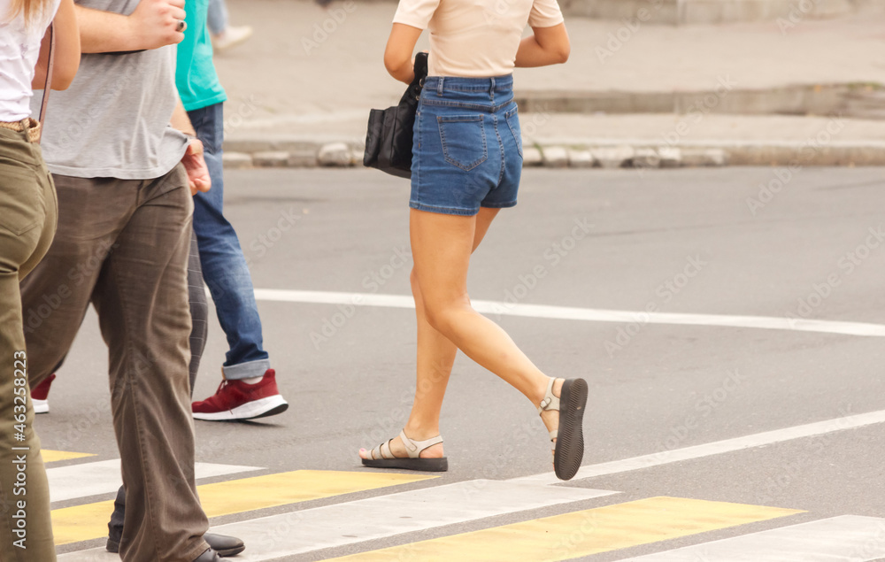 pedestrians walking on a crosswalk pedestrians walking on a crosswalk