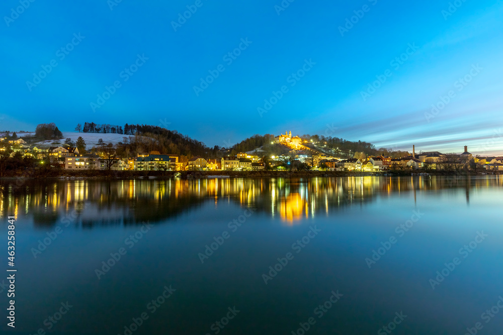 river inn view at Passau in Bavaria with reflection of promenade by night