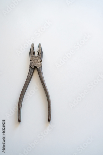 metal pliers on white background