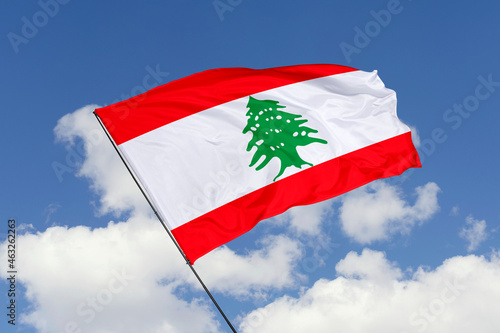Lebanon flag isolated on the blue sky background. close up waving flag of Lebanon. flag symbols of Lebanon. Concept of Lebanon.