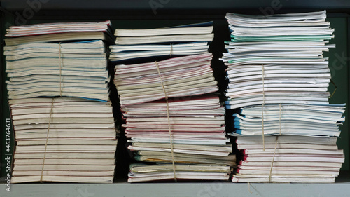  stacks of documents on a shelf