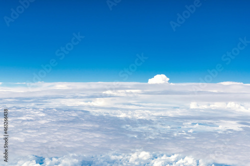 Blue and white cloudscape seen from an aircraft in mid-air