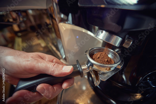 A measure of ground coffee taken into the handle for making espresso. Coffee, beverage, bar