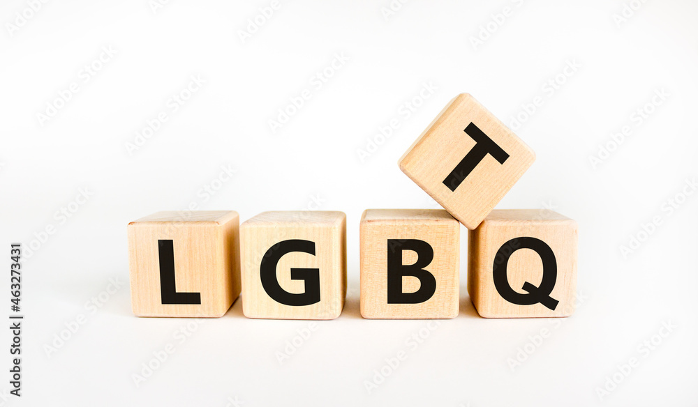 LGBTQ symbol. Concept word acronym 'LGBTQ' on wooden cubes. Beautiful white table, white background. LGBTQ concept, copy space. LGBTQ symbol. Concept word acronym 'LGBTQ' on wooden cubes. Beautiful white table, white background. LGBTQ concept, copy space.