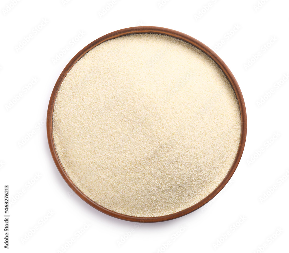 Bowl of uncooked organic semolina isolated on white, top view - obrazy, fototapety, plakaty 