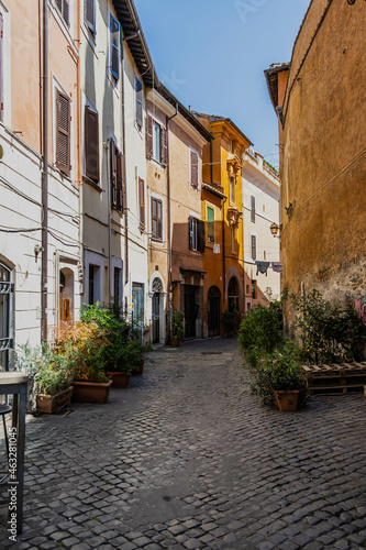 An alley leading through the traditional homes in the Trastevere neighborhood of Rome on a bright sunny day. #463281045