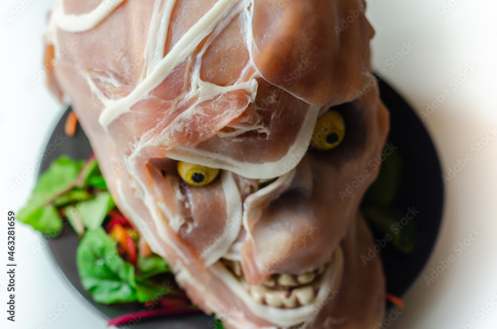 Creatively prepared food in the shape of a scary skull, a fun and interesting food serving for a halloween party Creatively prepared food in the shape of a scary skull, a fun and interesting food serving for a halloween party