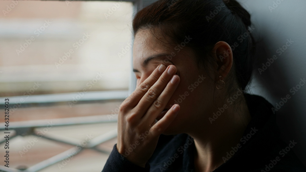 Woman rubbing eye with hand. Tired person rubs eyes and face Woman rubbing eye with hand. Tired person rubs eyes and face