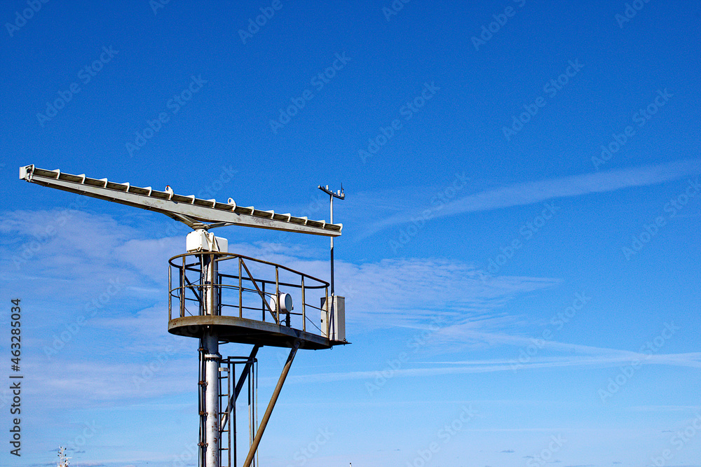 Marine radar tower, rotating antenna. Sea radar in the port of Ventspisls,  Latvia. Stock Photo