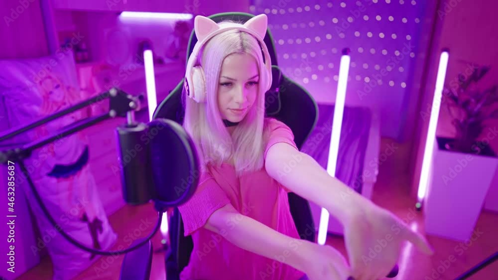 Cute Gamer Girl with cat ear headphones stretch hands and neck before gaming 4K Cute Gamer Girl with cat ear headphones stretch hands and neck before gaming 4K
