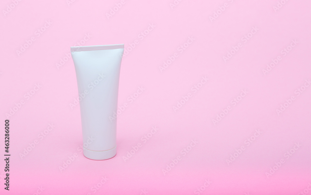 White different medecine or cosmetic jars on a pink background as a concept of cosmetology of medecine and treatment White different medecine or cosmetic jars on a pink background as a concept of cosmetology of medecine and treatment