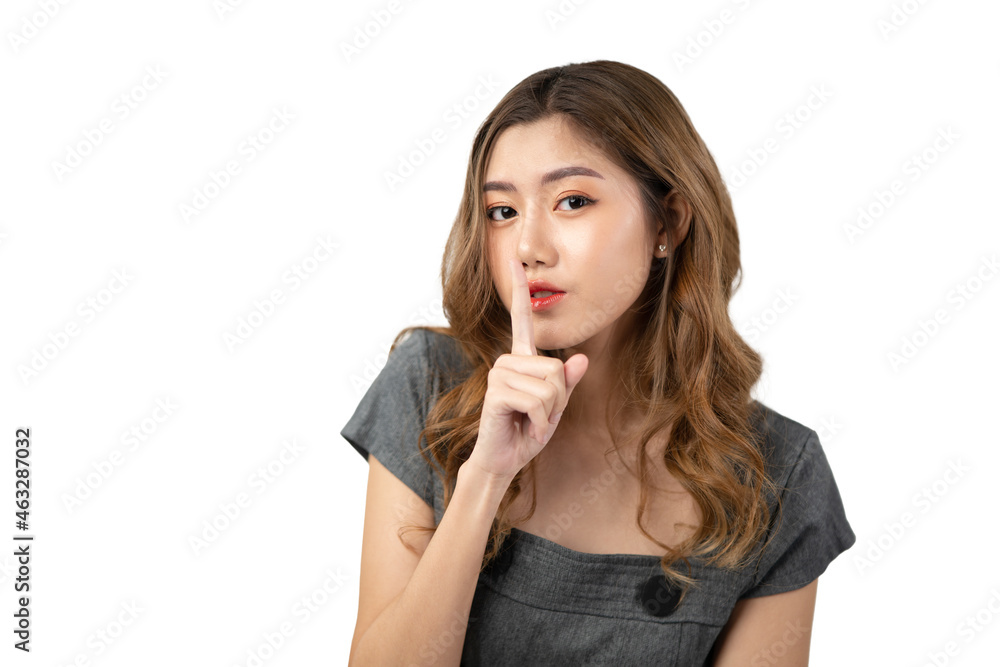 Charming young Asian woman having secret while holding finger on lips and showing silence sign, Isolated on white background. Charming young Asian woman having secret while holding finger on lips and showing silence sign, Isolated on white background.