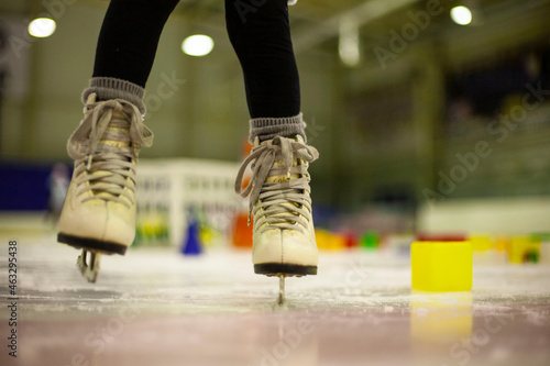 Little girl learns to skate. Children's skates. A child training on ice. The concept of children's figure skating. Children's sports. Winter sport © Артем Барынин