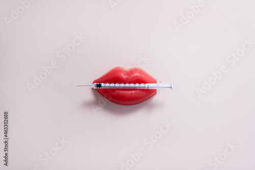 Obraz na płótnie Plasticine lips and medical syringe