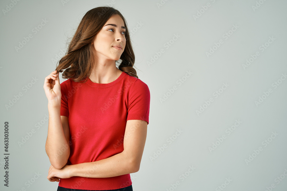 cheerful pretty woman in red t-shirt studio posing lifestyle cheerful pretty woman in red t-shirt studio posing lifestyle