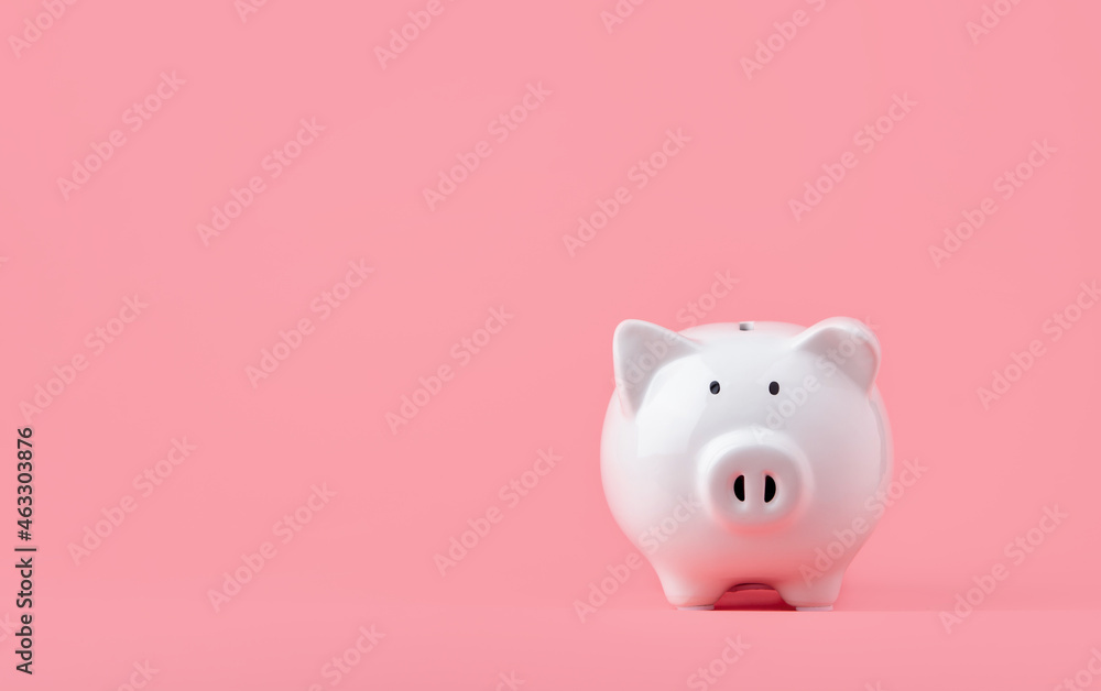 Money saving and investment concept. Piggy bank on pink background with copy space Money saving and investment concept. Piggy bank on pink background with copy space