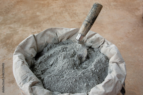 .Cement powder and trowel put in bag package..