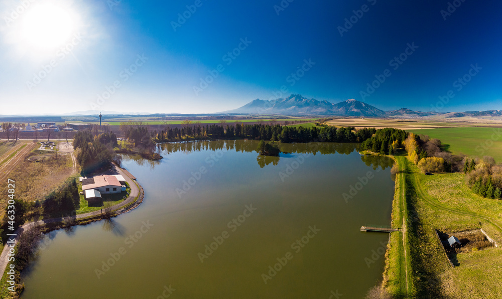 Obraz na płótnie Beliansky lake (rybnik) Spisska Bela with High Tatras in the background, Slovakia w salonie
