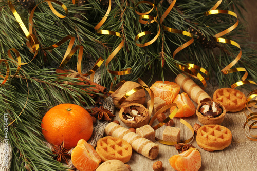 Still life formed with pine branches and New Year sweets 