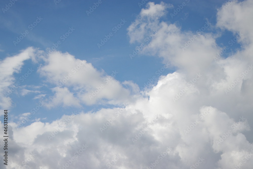 Cumulus clouds with a clear blue sky background in the midday. Types of clouds stock images. Cumulus clouds with a clear blue sky background in the midday. Types of clouds stock images.