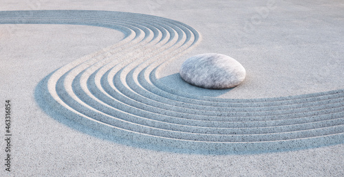 Fotografia Japanese ZEN garden - single stone and raked  sand in the evening sun