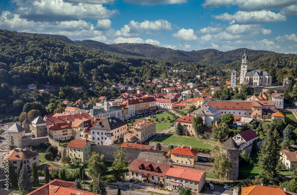 Aerial view of Kremnica, well-preserved medieval town built above important gold mines is the site of the oldest still-working mint in the world, fortified gothic Church of St. Catherine, city walls