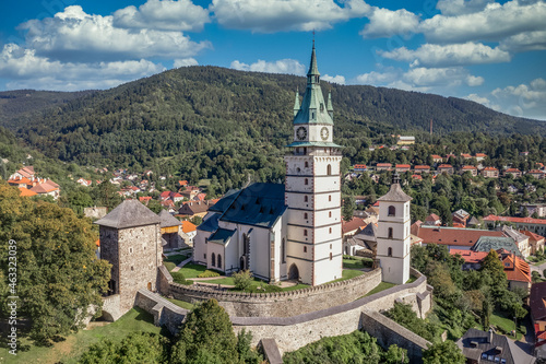 Aerial view of Kremnica, well-preserved medieval town built above important gold mines is the site of the oldest still-working mint in the world, fortified gothic Church of St. Catherine, city walls