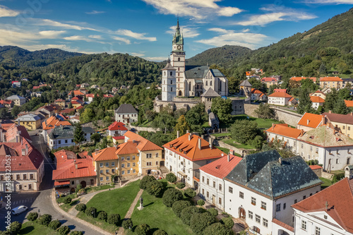 Aerial view of Kremnica, well-preserved medieval town built above important gold mines is the site of the oldest still-working mint in the world, fortified gothic Church of St. Catherine, city walls photo
