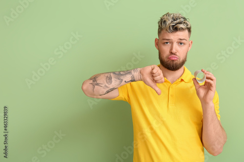 Sad young man out of toilet...
