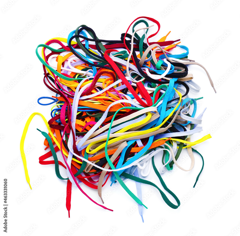 Heap of different shoe laces on white background